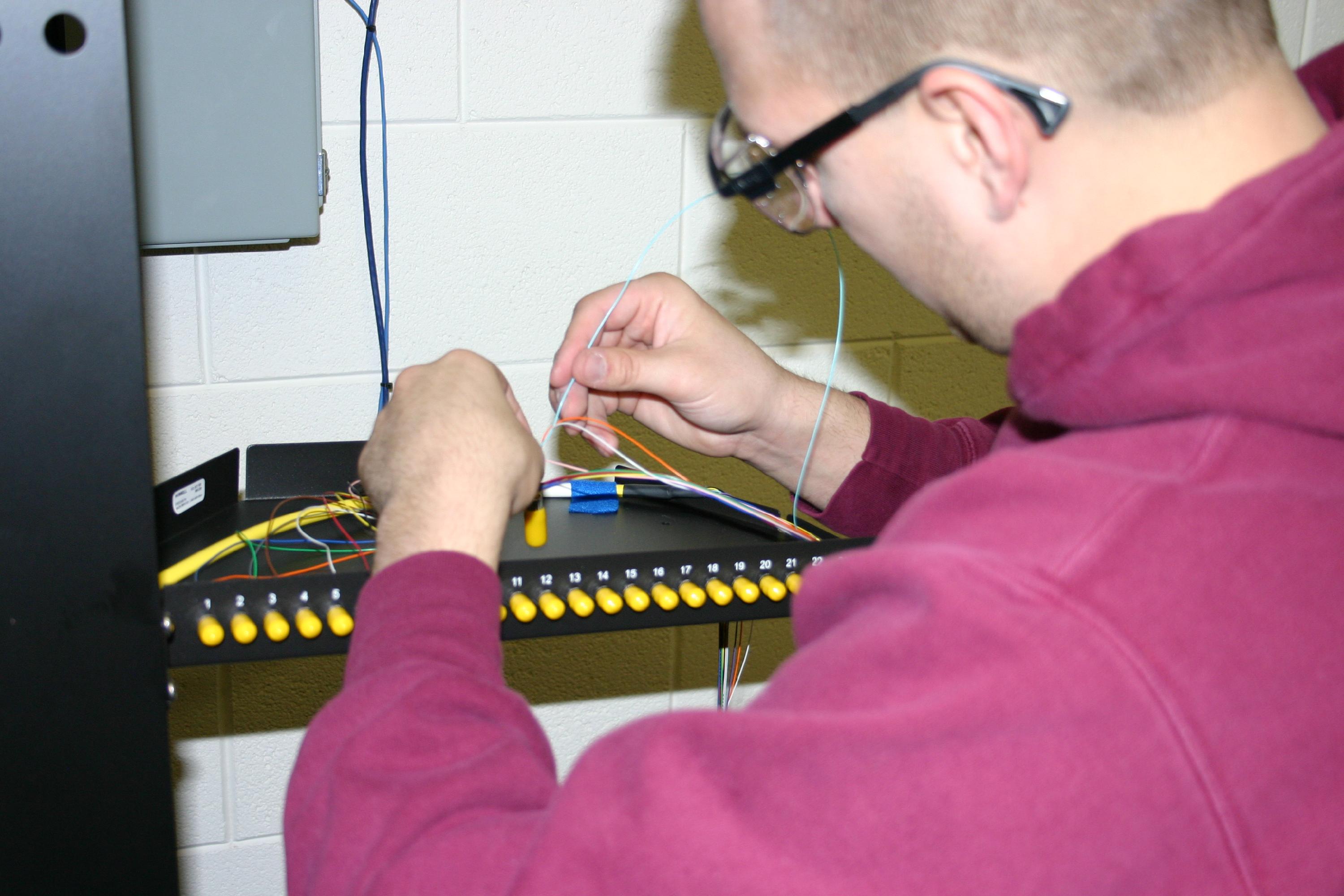 Student working with network cables